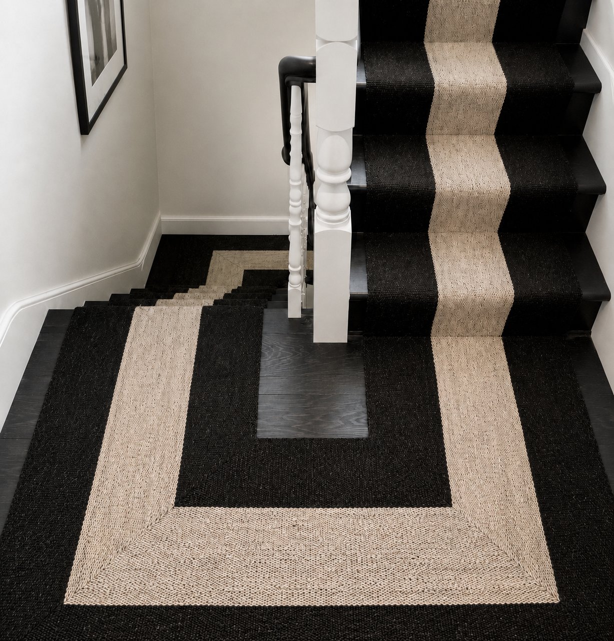 Black and cream bordered stair runner on staircase and landing